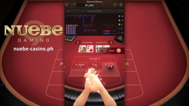 Ang Deluxe Baccarat ay isang kakaiba at kaakit-akit na pagkuha sa klasikong laro ng card mula sa PG Soft. Sa malalim na pagsisid sa online na bersyong ito, tututuon ang Nuebe Gaming sa mga namumukod-tanging feature nito, gameplay nuances at dynamics ng pagtaya. Para sa mga bago at may karanasang manlalaro, ginagarantiyahan ng aming gabay ang isang komprehensibong pag-unawa sa laro.